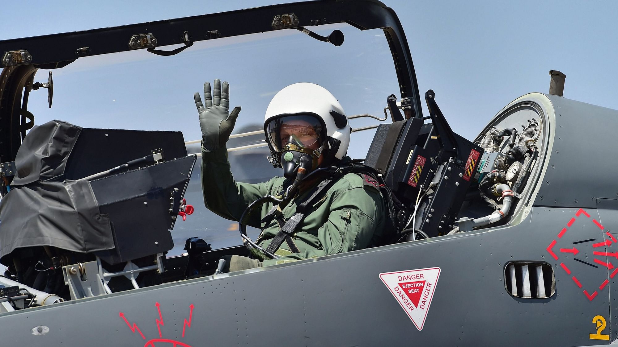 Chief of Army Staff Gen Bipin Rawat waves from the cockpit of the Light Combat Aircraft Tejas before a sortie on the 2nd day of the 12th edition of Aero India 2019 air show at Yelahanka air base in Bengaluru.