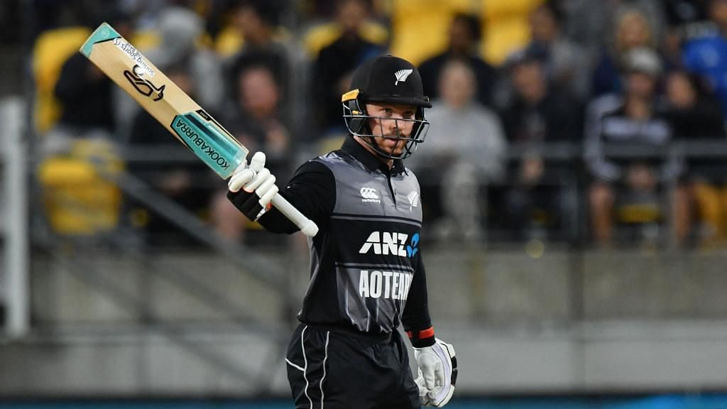 Tim Seifert raises his bat after bringing up his maiden international 50 during the first T20I between New Zealand and India at Wellington.