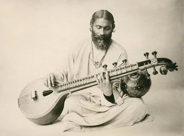 Inayat Khan playing the veena. 