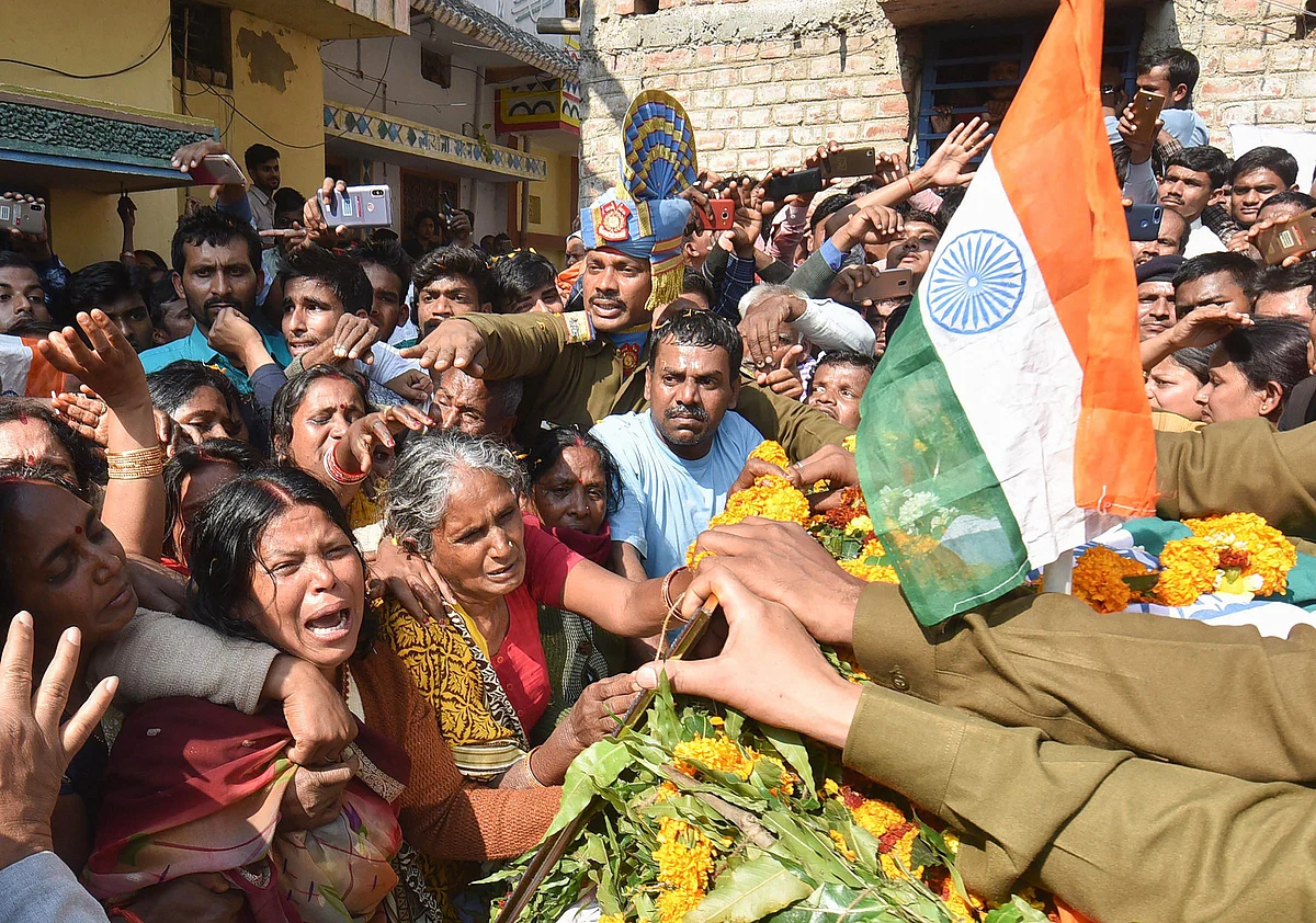 Family members of slain CRPF Sanjay Kumar Singh pay their last respects before the funeral procession, at Masaurhi, in Patna on 16 February 2019. 