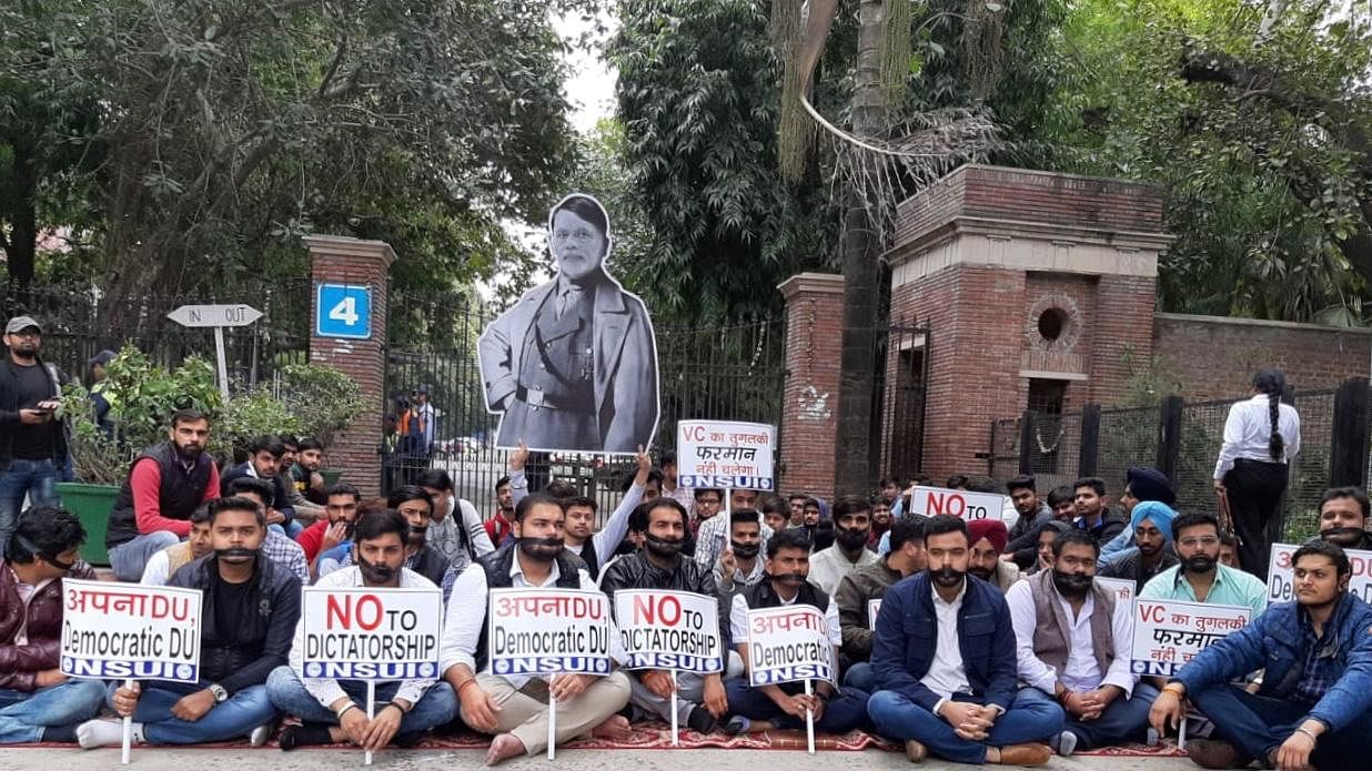 Students of National Students Union of India (NSUI) protest outside Delhi University’s Arts faculty entrance on 20 February.