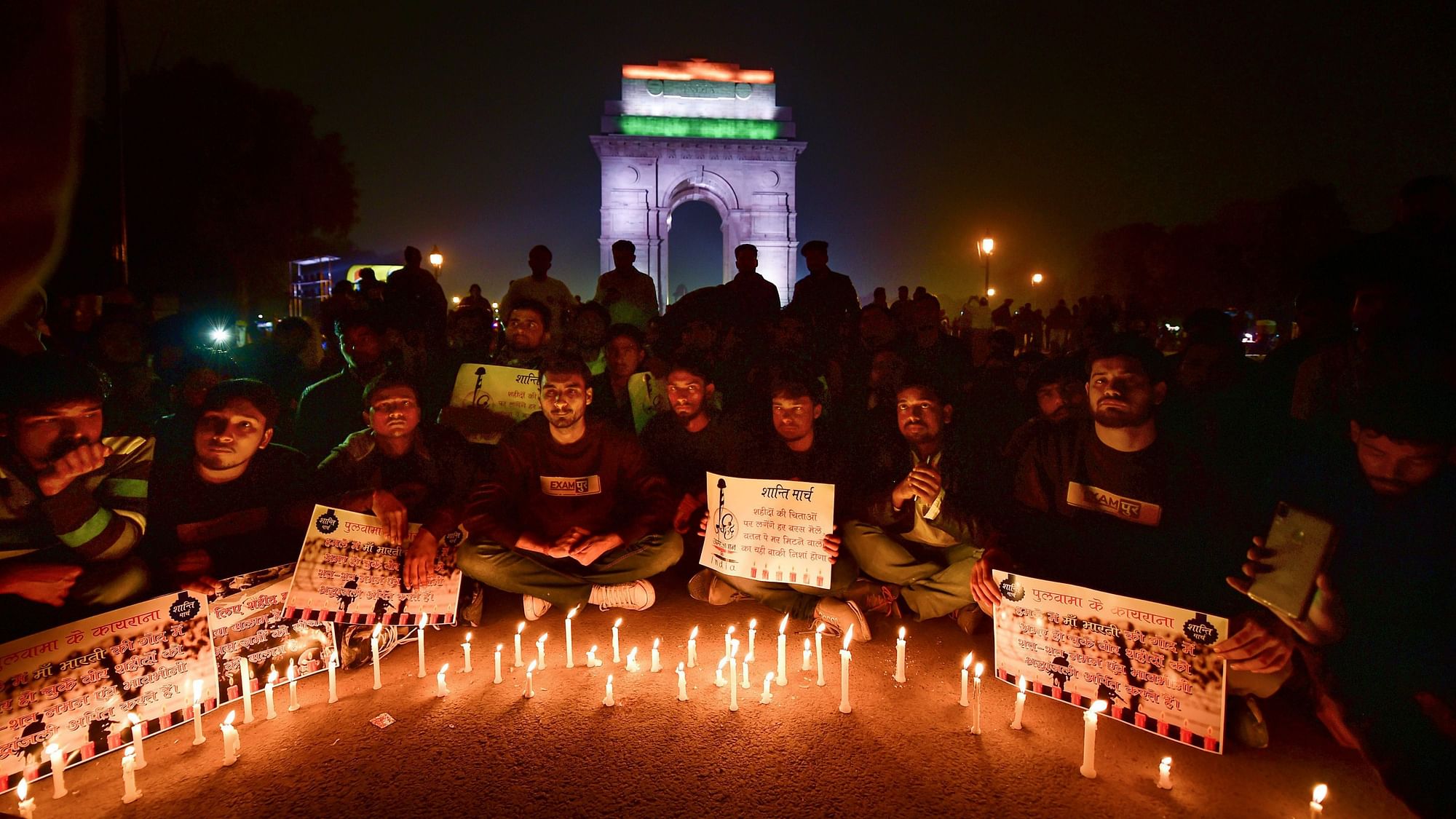 People participate in a candle light march to offer tributes to the martyred CRPF jawans of Pulwama terror attack.