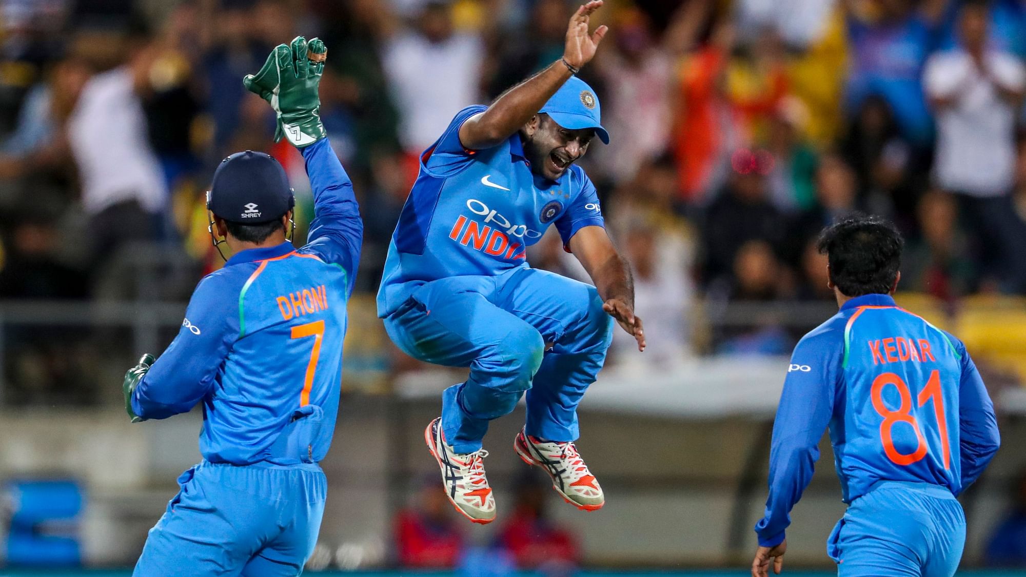 Indian players celebrate after MS Dhoni effected a run-out to dismiss James Neesham during the fifth ODI against New Zealand at Wellington.