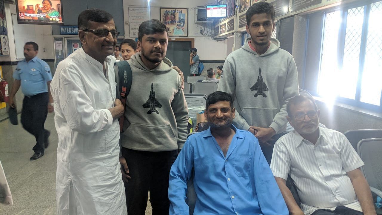 Chethan (L) with Wing Commander Vijay Shelke, Chethan’s friend Prajwal and the pilot’s father at the Air Force Command Hospital on Friday, 22 February.
