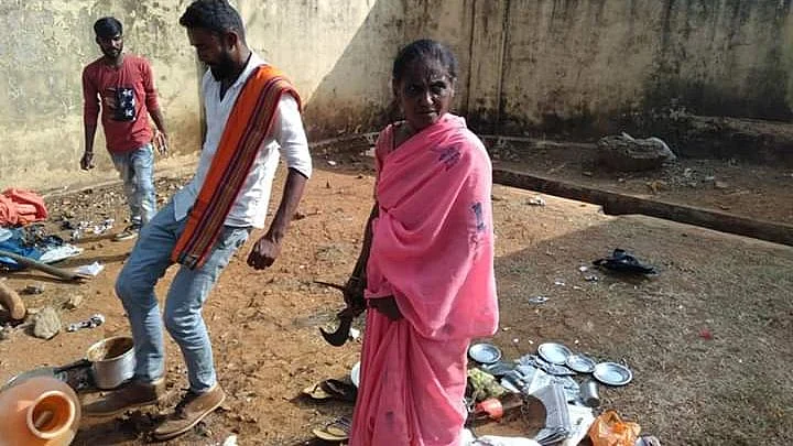 Khamrunissa watches in despair while miscreants destroy her food stall on 31 January in Sakleshpur.
