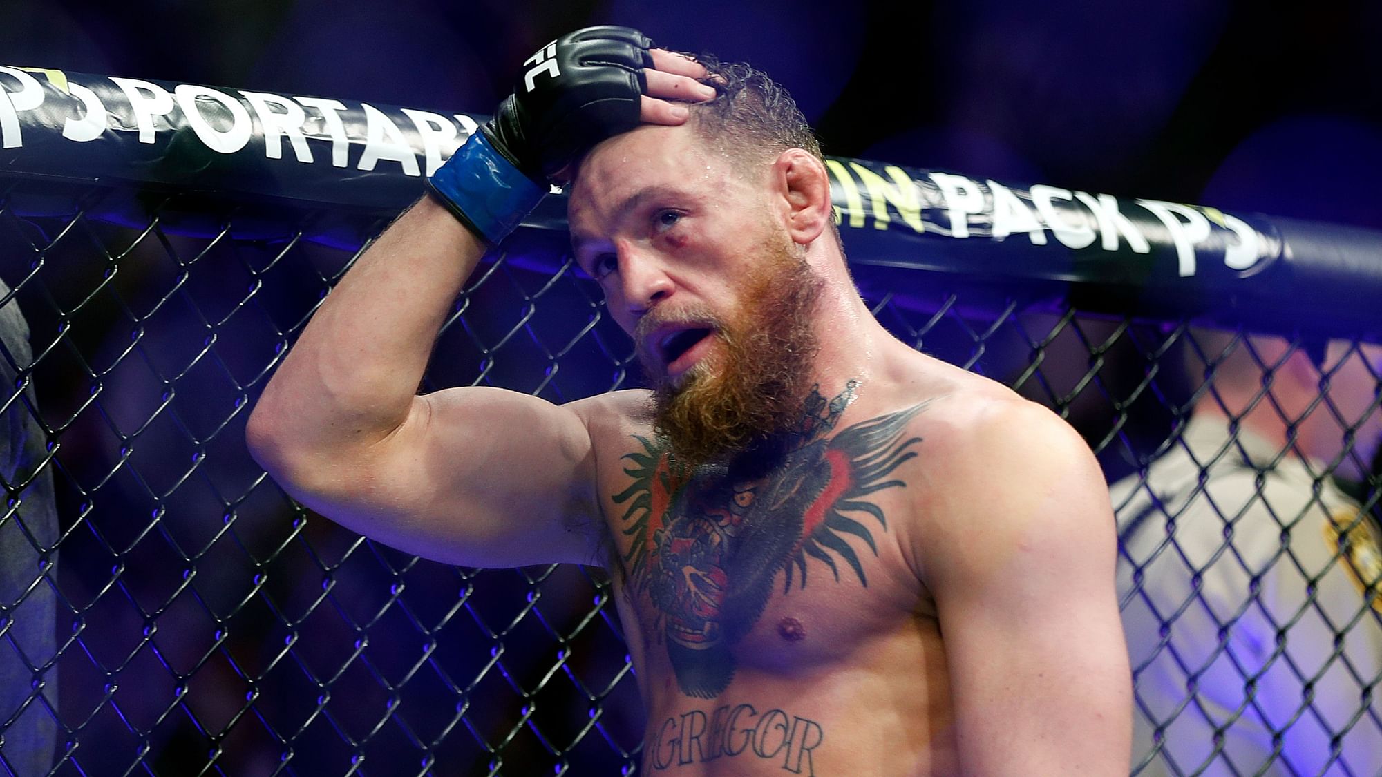 Conor McGregor reacts after losing to Khabib Nurmagomedov in a lightweight title mixed martial arts bout at UFC 229 in Las Vegas, Saturday, Oct. 6, 2018. Nurmagomedov won the fight by submission during the fourth round to retain the title.
