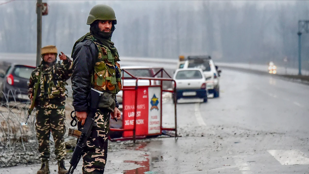 A file photo of Army soldiers standing guard near the site of suicide bomb attack at Lathepora Awantipora in Pulwama district on 14 February.