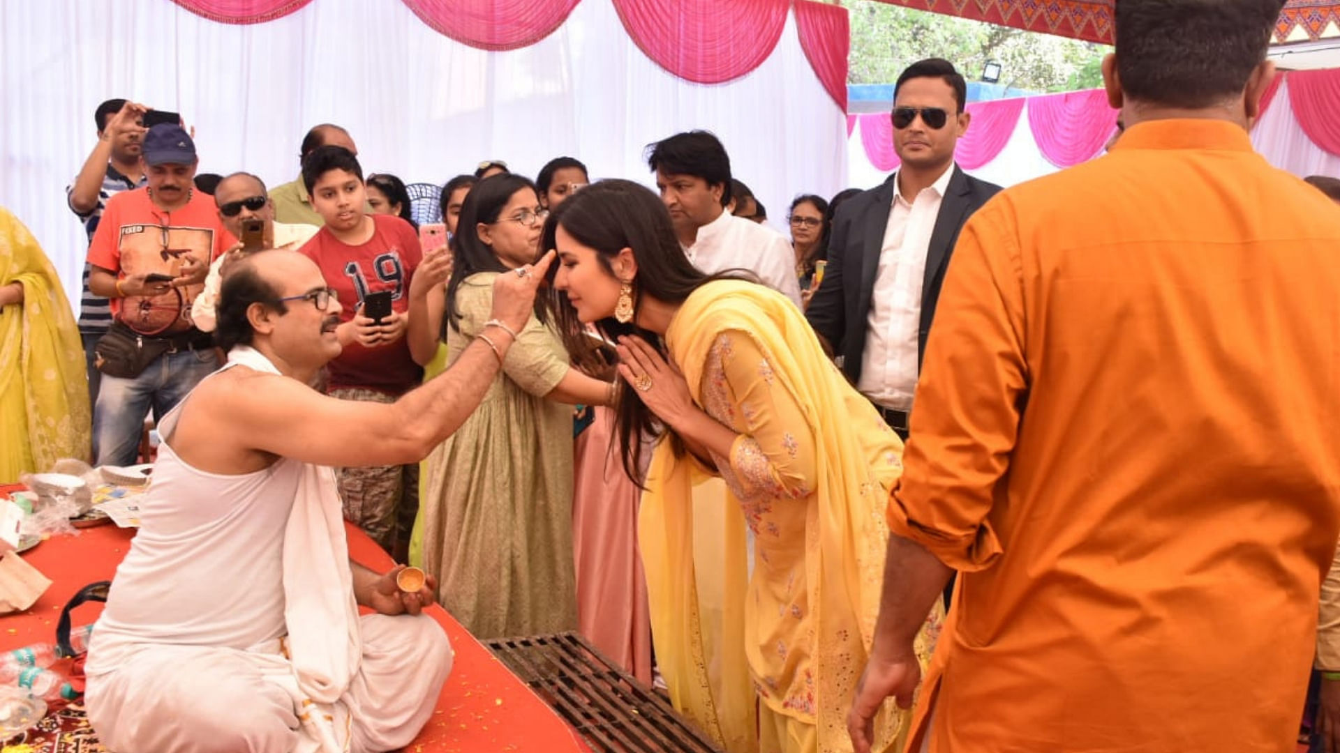 Katrina Kaif receives blessing from a pandit at Anurag Basu’s Saraswati Puja.