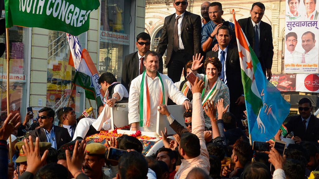 With brother Rahul Gandhi by her side, a beaming Priyanka Gandhi waved at the crowd jostling for a glimpse of her.