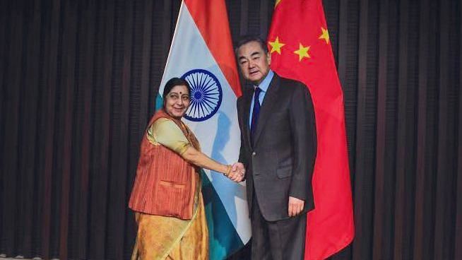 Sushma Swaraj with her Chinese counterpart Wang Yi.&nbsp;