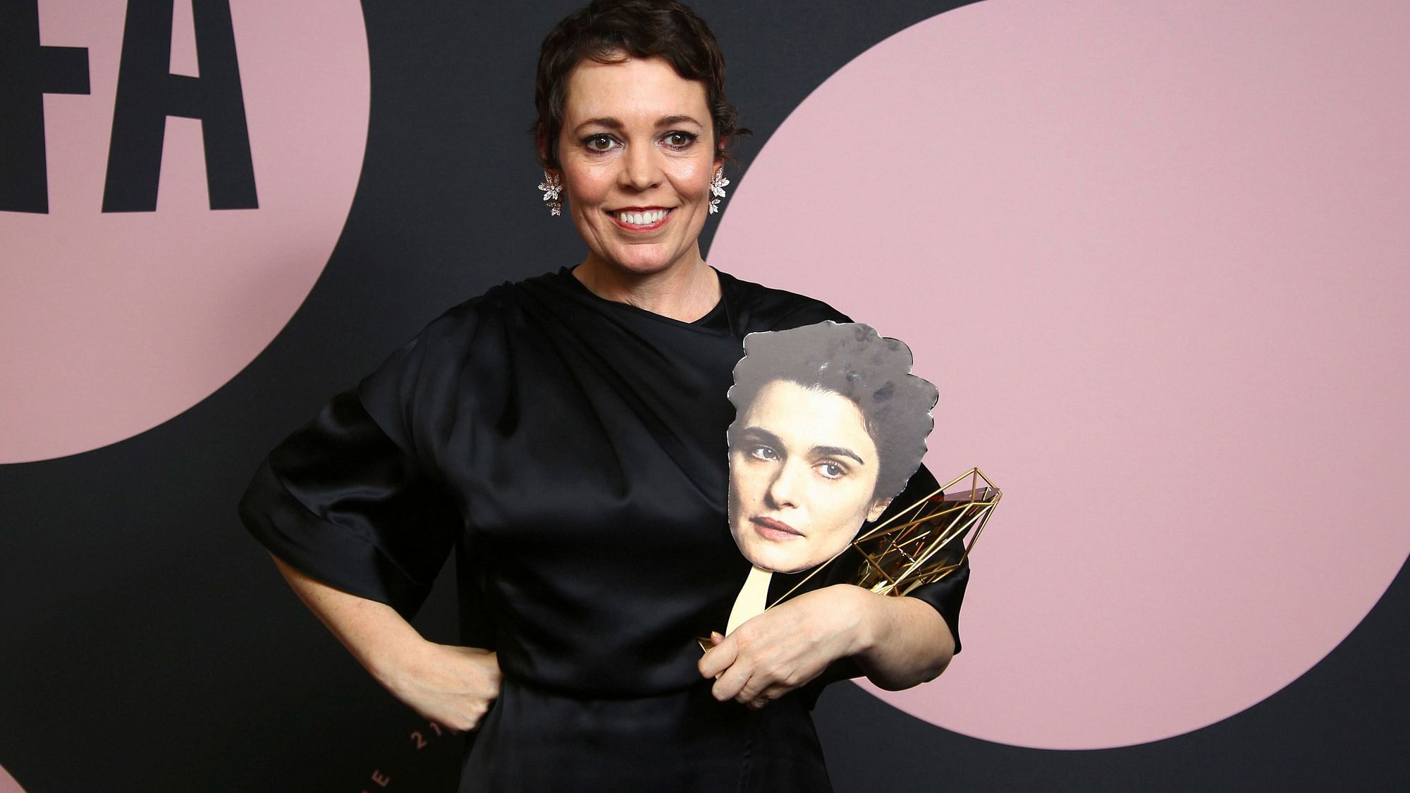 Actor Olivia Colman poses for photographers with the Best Actress award.&nbsp;