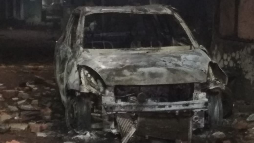 A car torched in by the mob during the stone-pelting incident in Shahpur, Ahmedabad.
