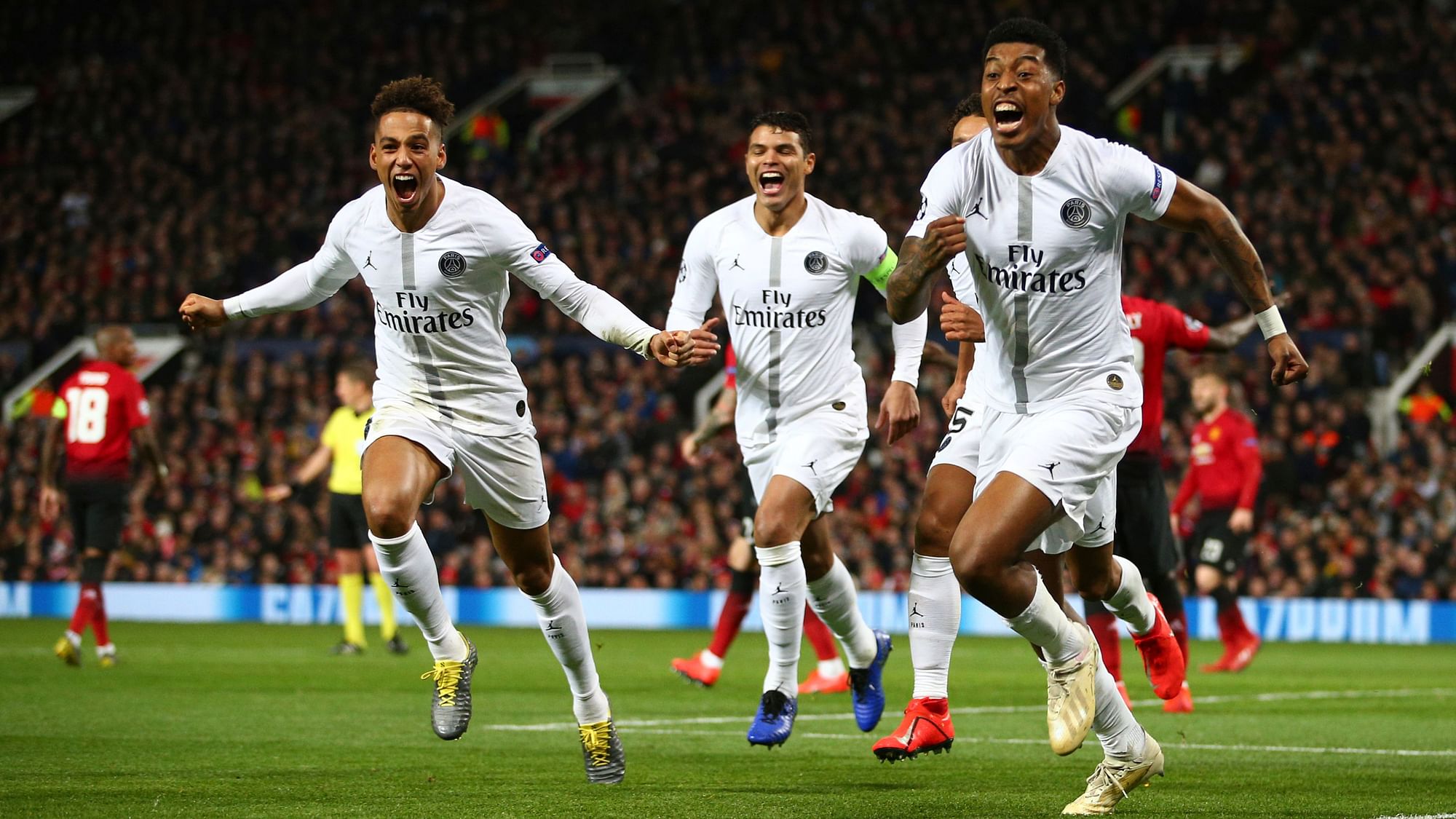 Paris Saint Germain’s Presnel Kimpembe, right, celebrates after scoring the opening goal.