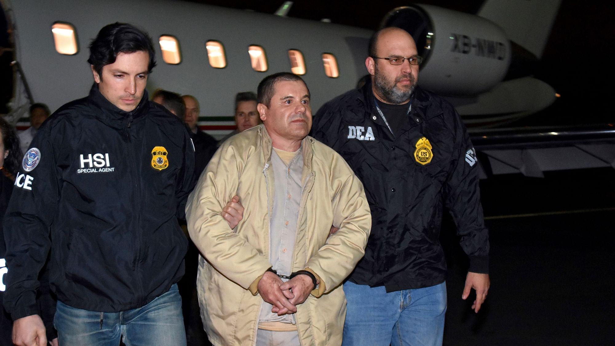 In this 19 January2017 file photo provided U.S. law enforcement, authorities escort Joaquin “El Chapo” Guzman.