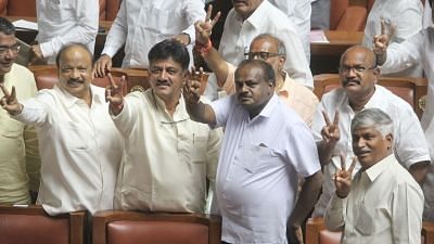 Bengaluru: JD(S) MLA H.D. Kumaraswamy and Congress MLA D. K. Shivakumar celebrate along with other legislators of both the parties after Karnataka Chief Minister B.S. Yeddyurappa resigned before facing a crucial trust vote in the Karnataka Assembly with numbers stacked against the BJP in the newly elected House; in Bengaluru on May 19, 2018. (Photo: IANS)