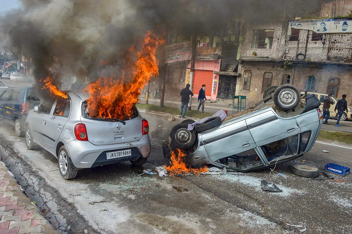 Vehicles set on fire by protestors against the killing of CRPF personnel in the Pulwama terror attack, during a shutdown call given by Jammu Chamber of Commerce and Industry (JCCI) in Jammu. 