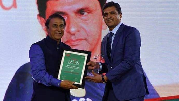 Sunil Gavaskar presents Prakash Padukone with the Lifetime Achievement award at the Sportstar Aces Awards in Mumbai.