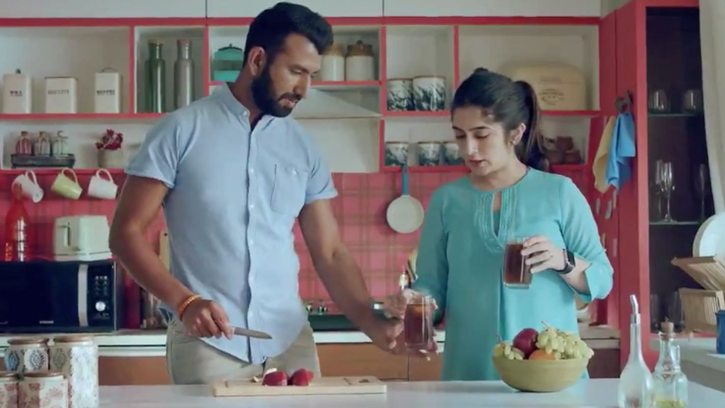 Cheteshwar Pujara, seen here with wife Puja, in a grab from his advertisement for SBI Life Insurance.