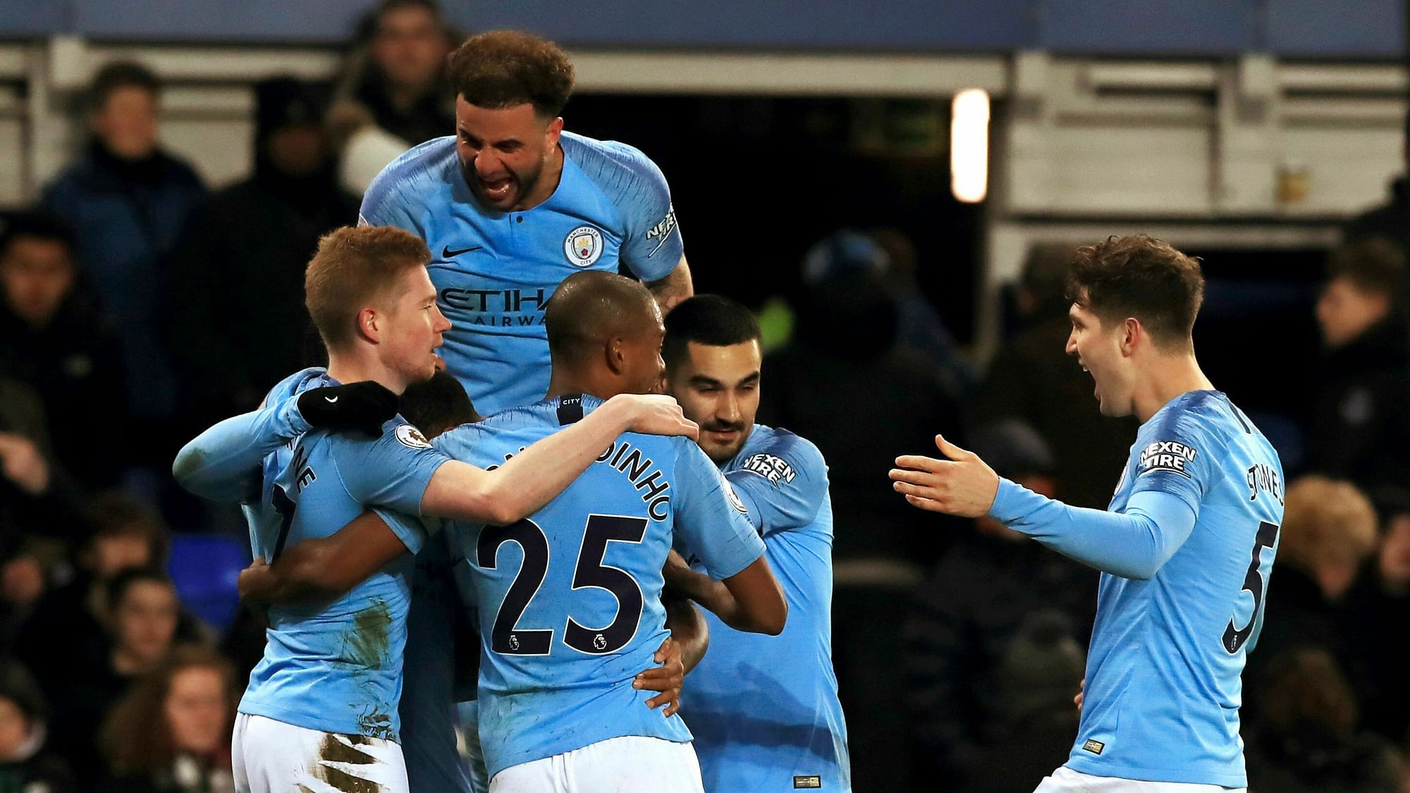 Manchester City players celebrate after Gabriel Jesus (hidden) scored the second goal in their 2-0 win against Everton.