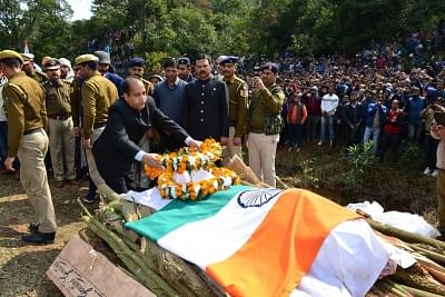 Kangra: Himachal Pradesh Chief Minister Jai Ram Thakur pays his last respects to martyr Tilak Raj, who was among the 49 CRPF personnel killed in a suicide attack by militants in Jammu and Kashmir