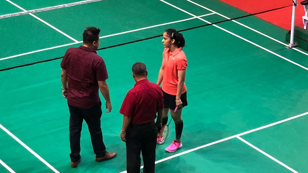 Saina Nehwal (right) pictured speaking with BAI officials to voice her disapproval of the playing surface at the Nationals in Guwahati.