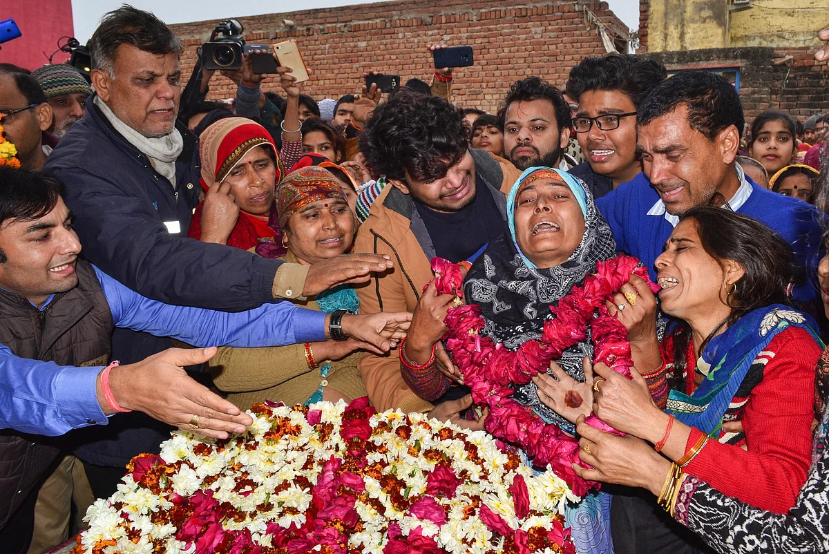 CRPF jawan Kaushal Kumar Rawat’s family members bid their goodbyes, in Agra on 16 February 2019. 