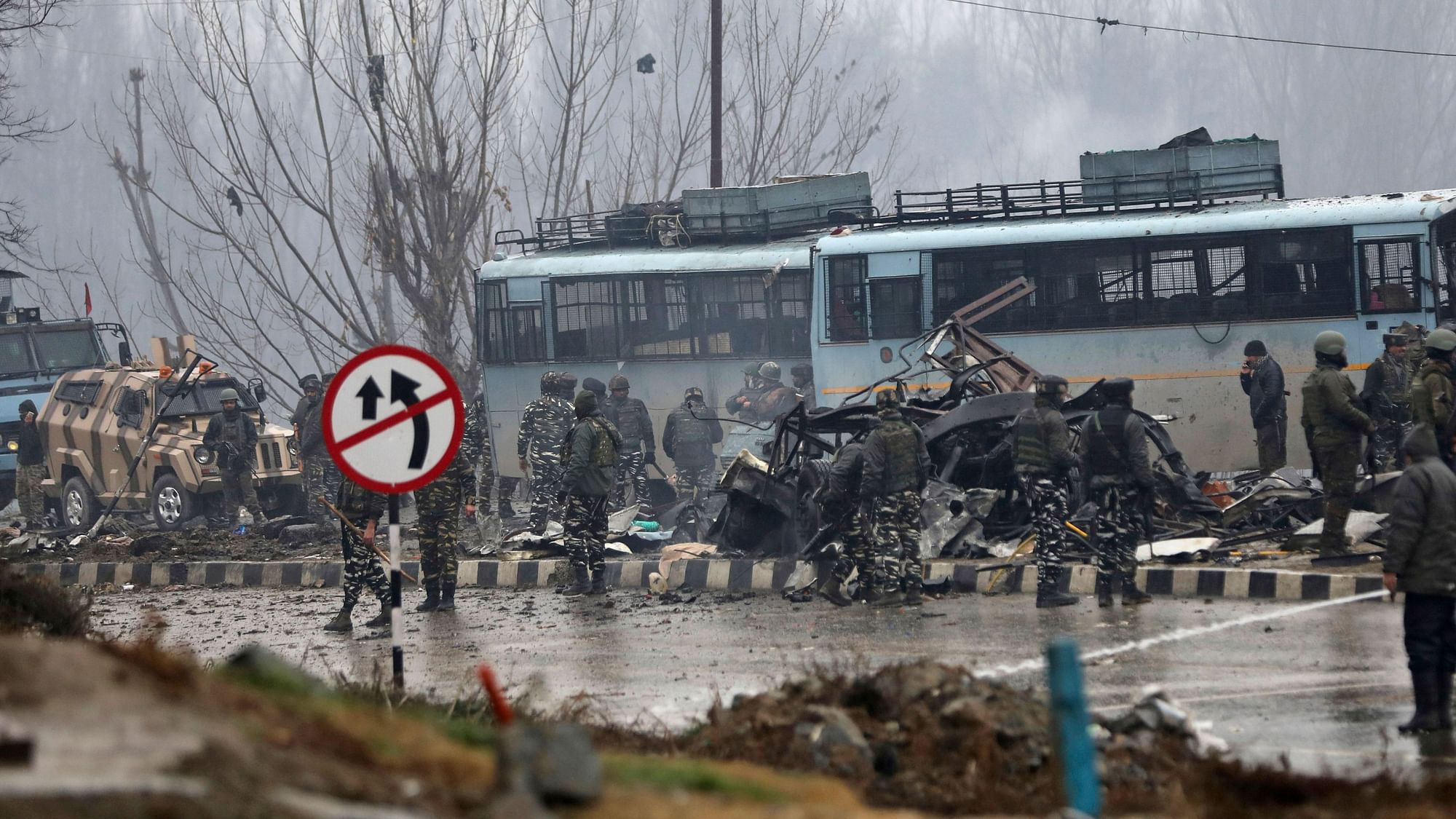 Security personnel carry out the rescue and relief works at the site of suicide bomb attack at Lathepora Awantipora in Pulwama district of south Kashmir, Thursday, 14 February. At least 40 CRPF jawans were killed and dozens other injured when a CRPF convoy was attacked.