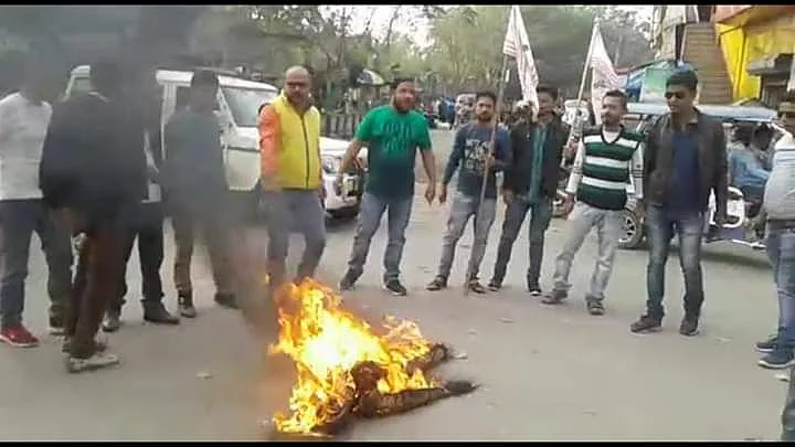 AJYCP activists burn the effigy of Excise Minister Parimal Suklabaidya.