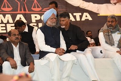 New Delhi: Former Prime Minister and Congress leader Manmohan Singh with Andhra Pradesh Chief Minister N. Chandrababu Naidu, who began a 12-hour long fast demanding the Centre to accord special category status and fulfill other commitments made in Andhra Pradesh Reorganisation Act, 2014, in New Delhi on Feb 11, 2019. (Photo: IANS)