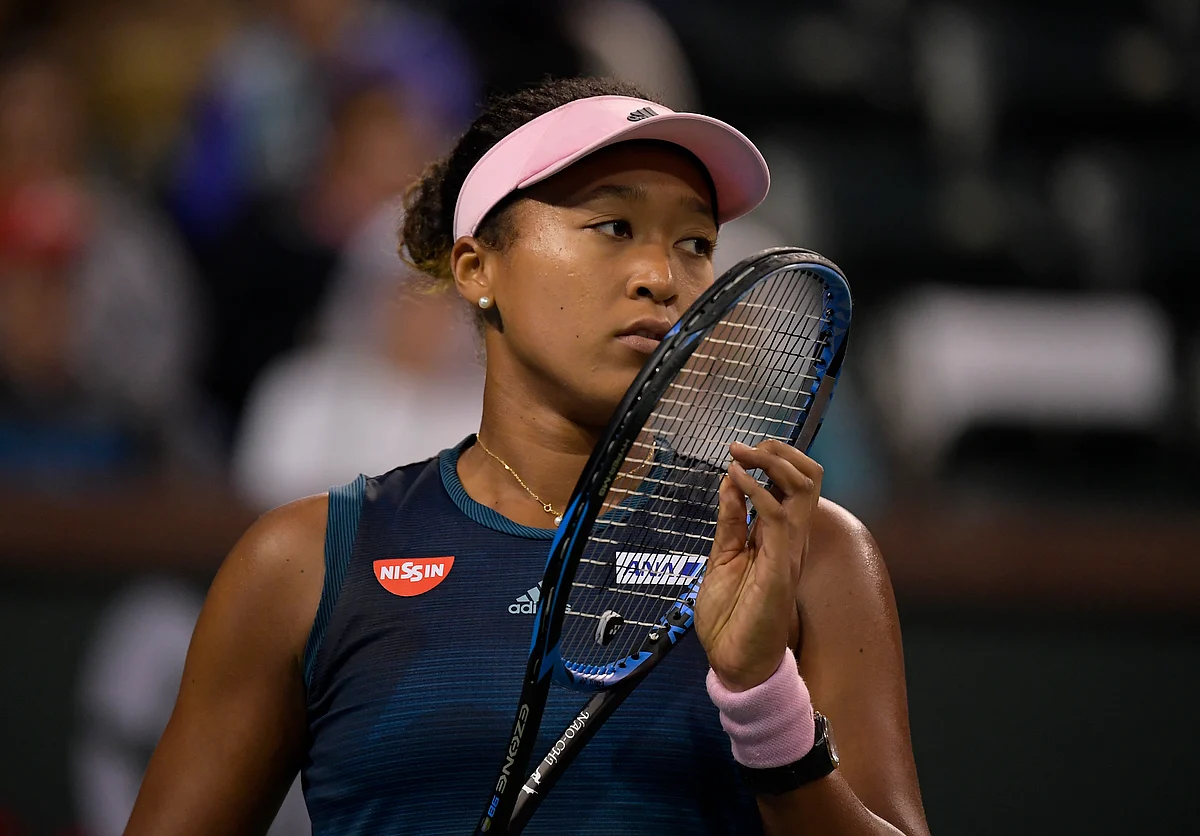 Naomi Osaka, of Japan, reacts after losing a game to Belinda Bencic, of Switzerland, at the BNP Paribas Open.