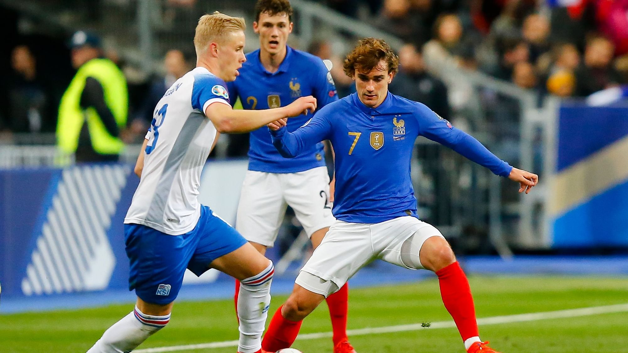 France’s Antoine Griezmann, right, challenges for the ball with Iceland’s Hordur Magnusson during the Euro 2020 group H qualifying soccer match between France and Iceland at Stade de France stadium in Saint Denis on Monday, 25 March.