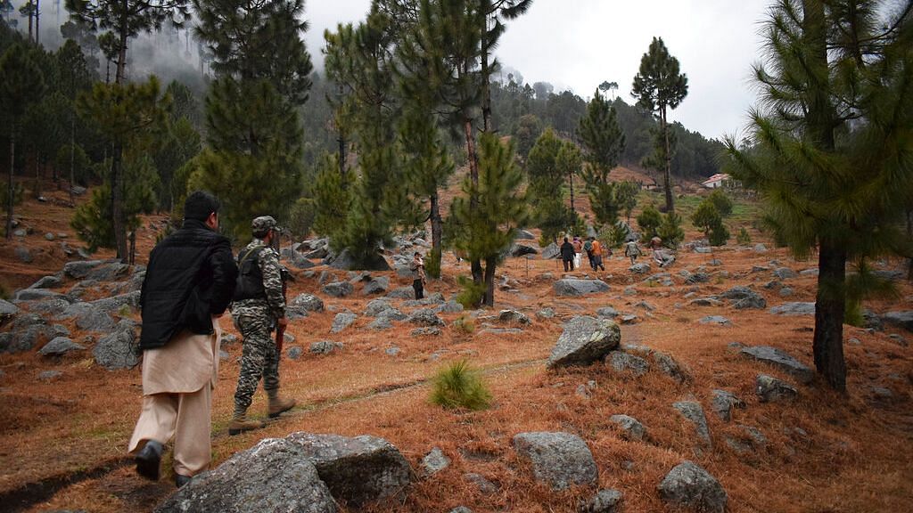 File image of Pakistani reporters and troops visiting the site of an Indian air strike in Jaba, near Balakot, Pakistan on 26 February.