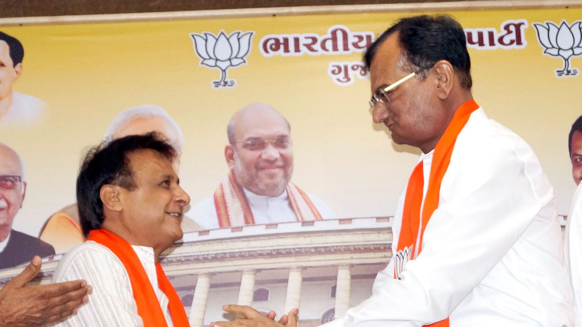 Former Gujarat MLA Jawahar Chavda (left) joins the BJP after quitting the Congress party. He is welcomed to the party by Minister of State for Home Pradipsinh Jadeja.