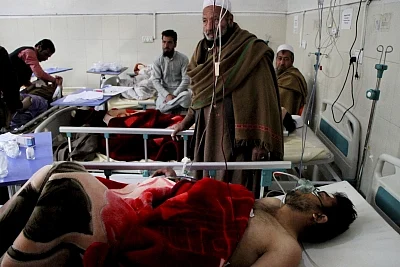 NANGARHAR, March 6, 2019 (Xinhua) -- Injured men receive medical treatment at a local hospital after an attack in Nangarhar province, Afghanistan, March 6, 2019. A total of 21 people including five attackers were killed and nine others injured as a blast followed by gun shots rocked Jalalabad city, the capital of eastern Nangarhar province on Wednesday, provincial government spokesman Attaullah Khogiani said. (Xinhua/Saifurahman Safi/IANS)
