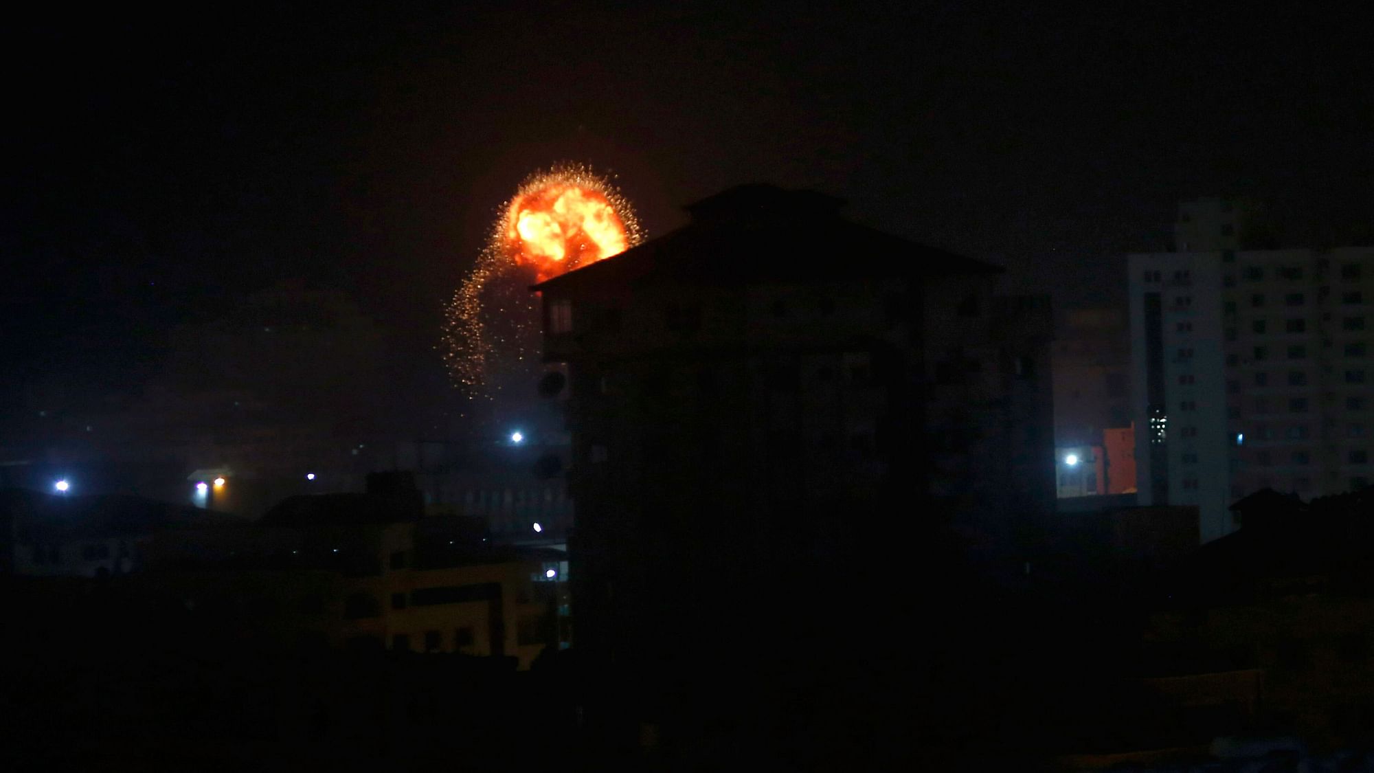 An explosion caused by Israeli airstrikes is seen on Gaza City, early Friday, 15 March, 2019.