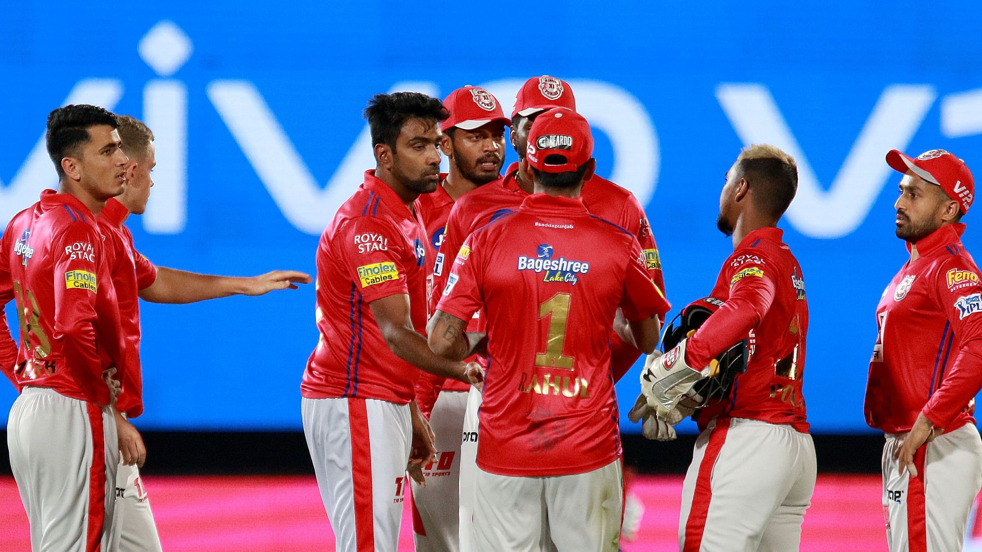 Teammates congratulate R Ashwin after he picked up Ajinkya Rahane’s wicket.