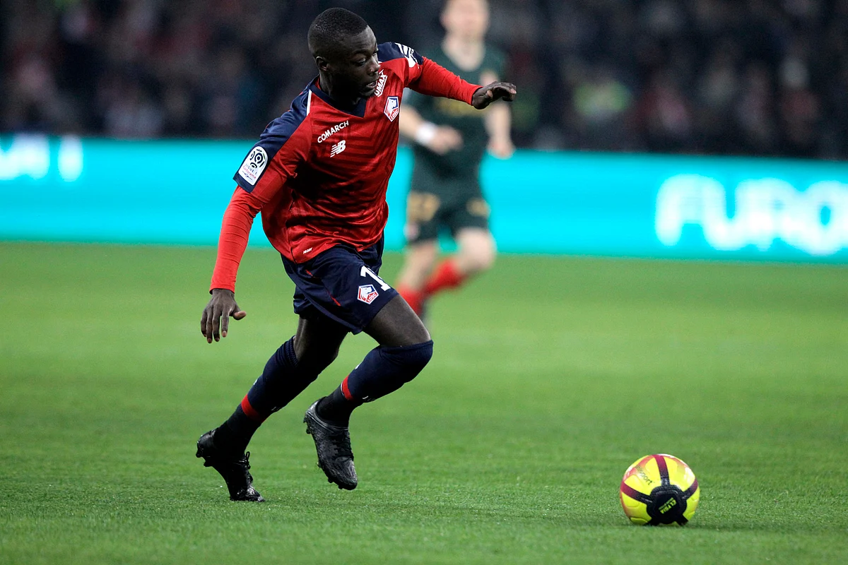 Lille’s Nicolas Pepe controls the ball during the French League One soccer match between Lille and Monaco at the Lille Metropole stadium, in Villeneuve d’Ascq, northern France, Friday, March 15, 2019. 