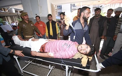 Jammu: One of the 30 persons inured in Jammu bus stand grenade attack being wheeled into a Jammu hospital for treatment on March 7, 2019. One person was killed when a grenade was rolled under a packed parked bus in Jammu