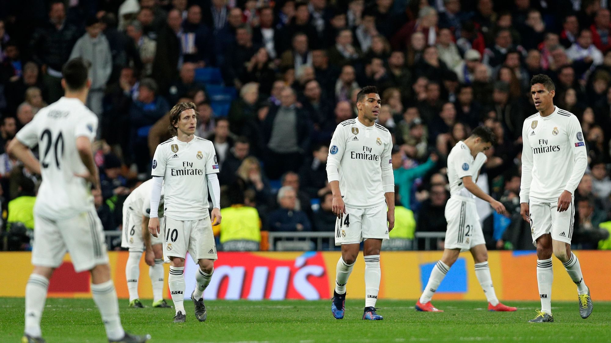 Real Madrid player react as Ajax’s Dusan Tadic celebrates scoring his side’s 3rd goal, during the Champions League soccer match between Real Madrid and Ajax at the Santiago Bernabeu stadium in Madrid, Spain, Tuesday, March 5, 2019.&nbsp;