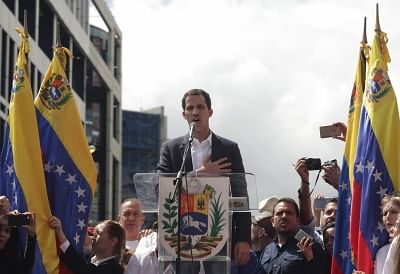 Juan Guaido (C), head of the opposition-controlled National Assembly, delivers a speech at the Francisco de Miranda avenue, in Caracas, Venezuela, on Jan. 23, 2019. Venezuelan President Nicolas Maduro on Wednesday announced he was severing "diplomatic and political" ties with the United States after the U.S. authorities recognized the opposition leader Juan Guaido as the nation