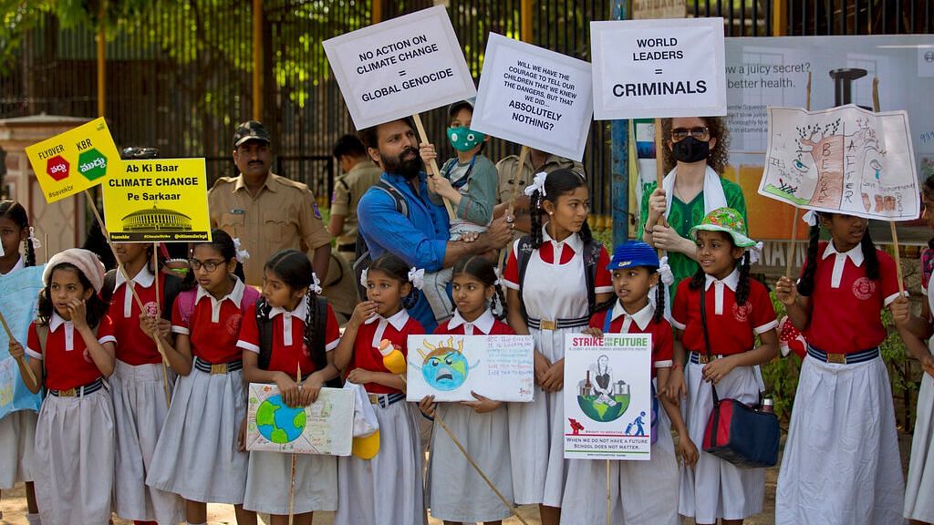 Adults stand in solidarity with students in a climate protest in Hyderabad on Friday, 15 March  2019.&nbsp;