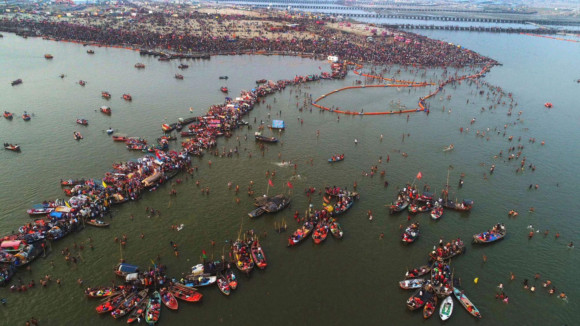 Devotees gather to take a holy dip on the occasion of Maha Shivaratri festival during the ongoing Kumbh Mela in Prayagraj (Allahabad) on Monday, 4 March.&nbsp;