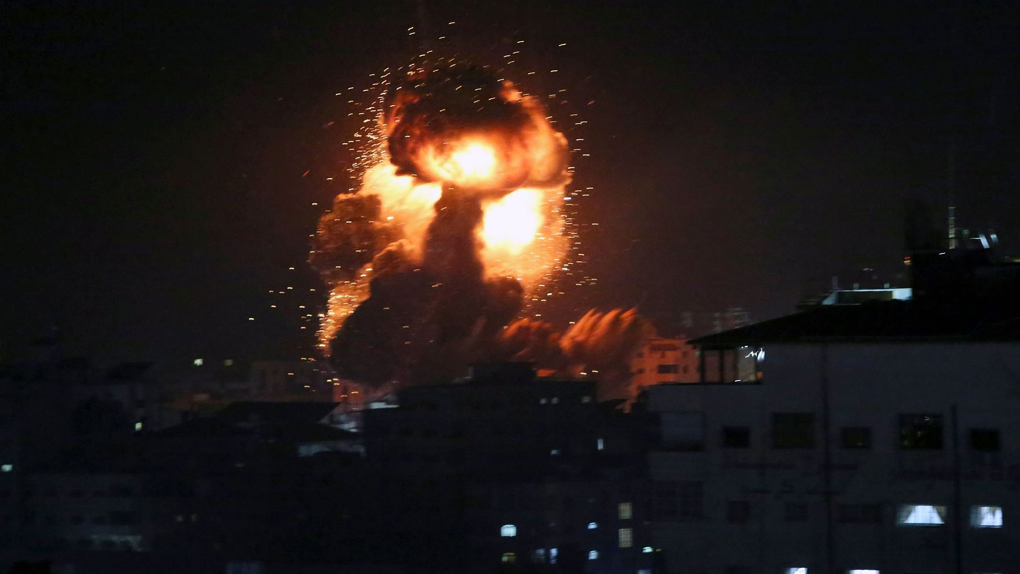 An explosion caused by Israeli airstrikes is seen from the offices of Hamas leader Ismail Haniyeh.