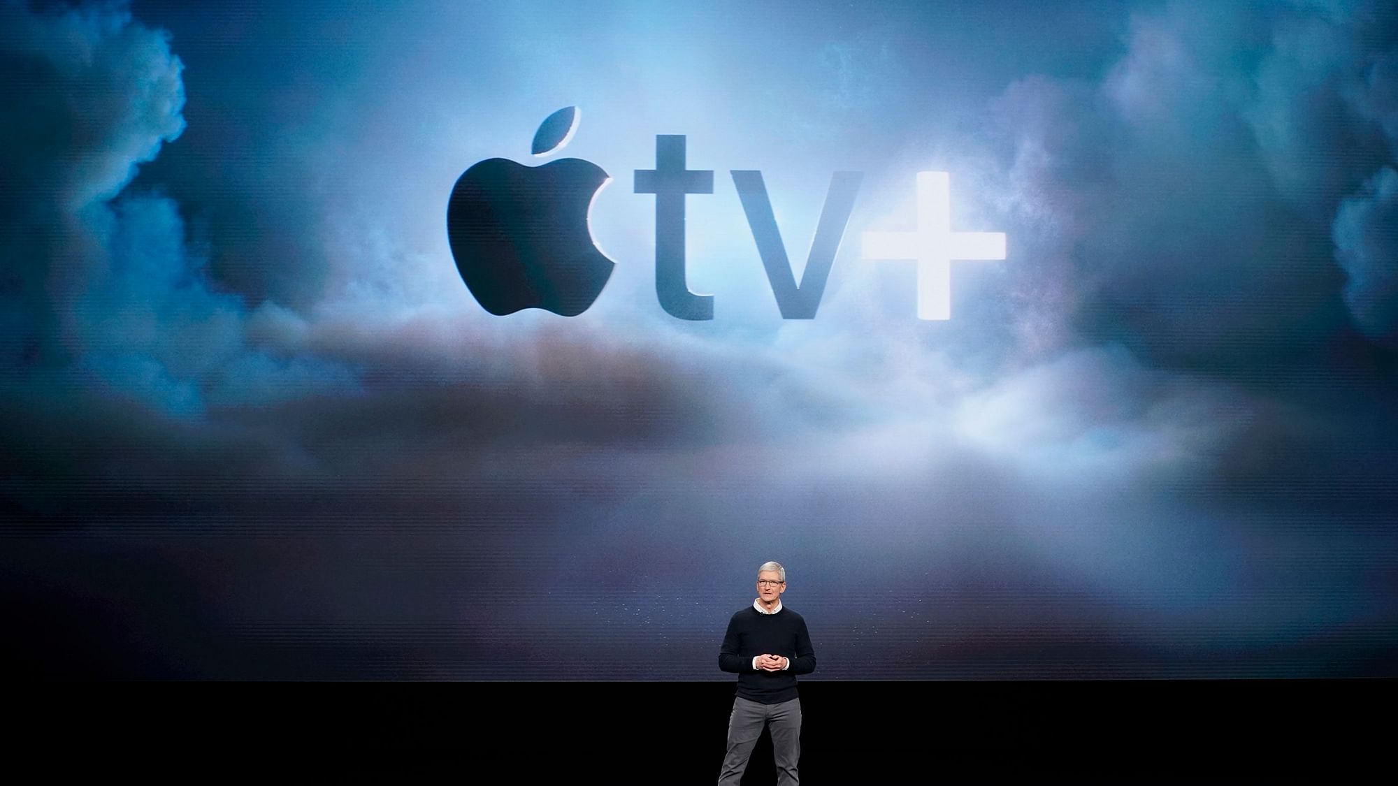 Apple CEO Tim Cook speaks at the Steve Jobs Theater during an event to announce new products.