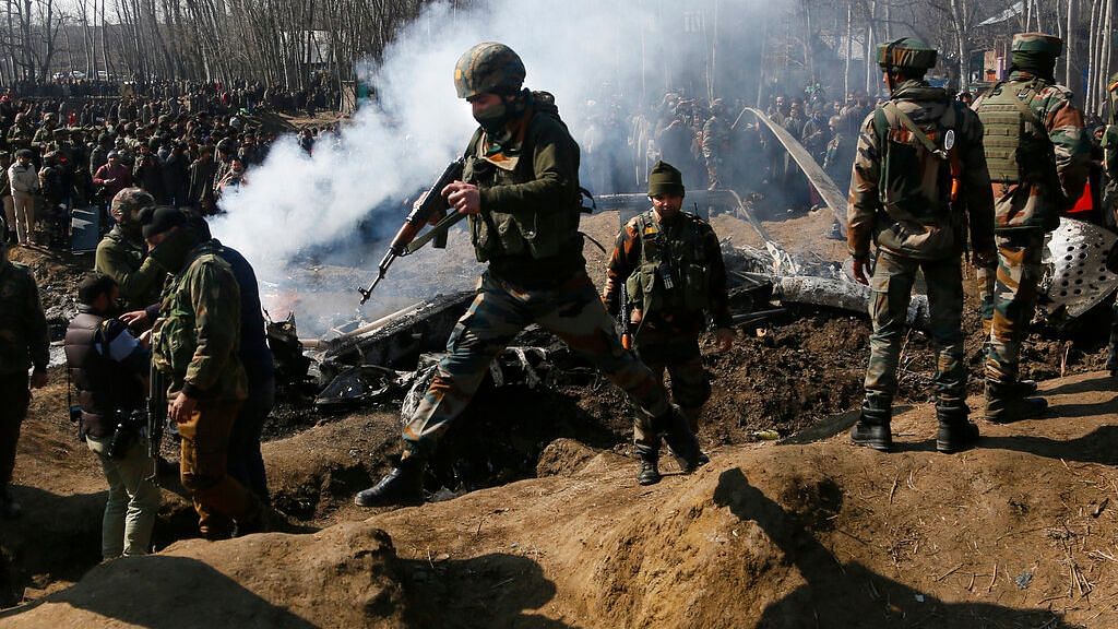 Feb. 27, 2019. Indian Army soldiers arrive at the wreckage of an an Indian helicopter after it crashed in Budgam area. Image used for representation.