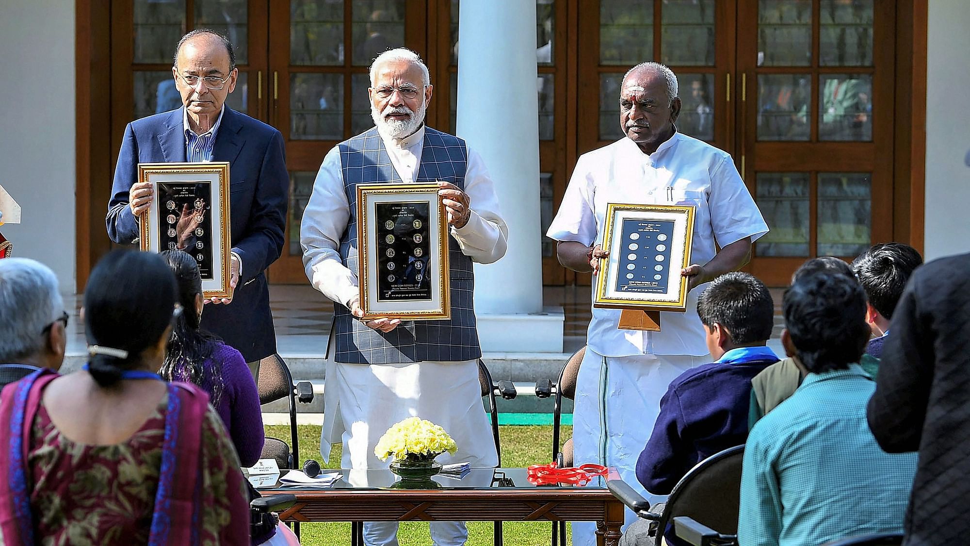 Prime Minister Narendra Modi releases the new series of visually impaired-friendly circulation coins at a function in New Delhi.