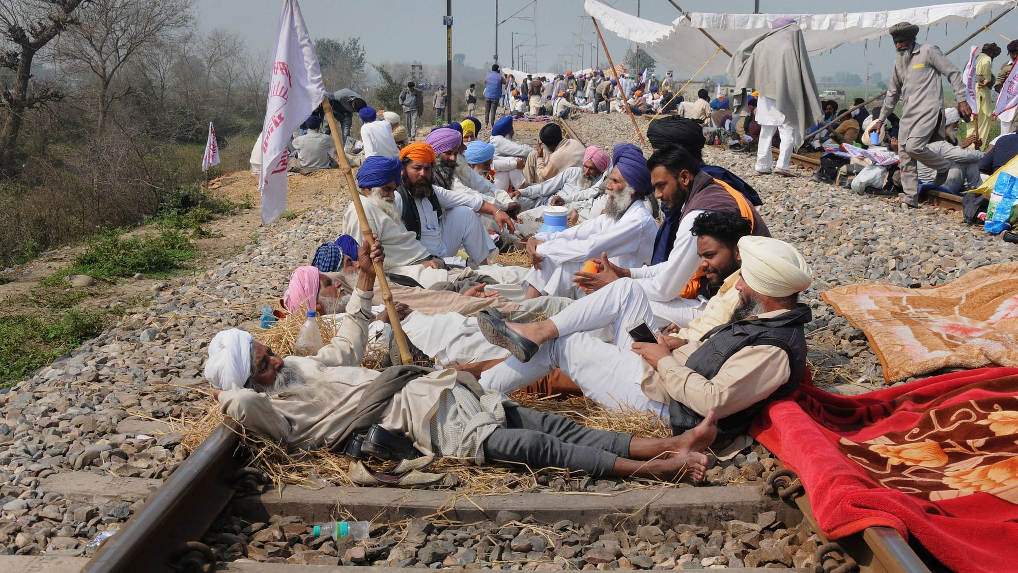 Farmers block a railway track during a protest organised under the banner of Kisan Mazdoor Sangharsh Committee (KMSC) in Amritsar.