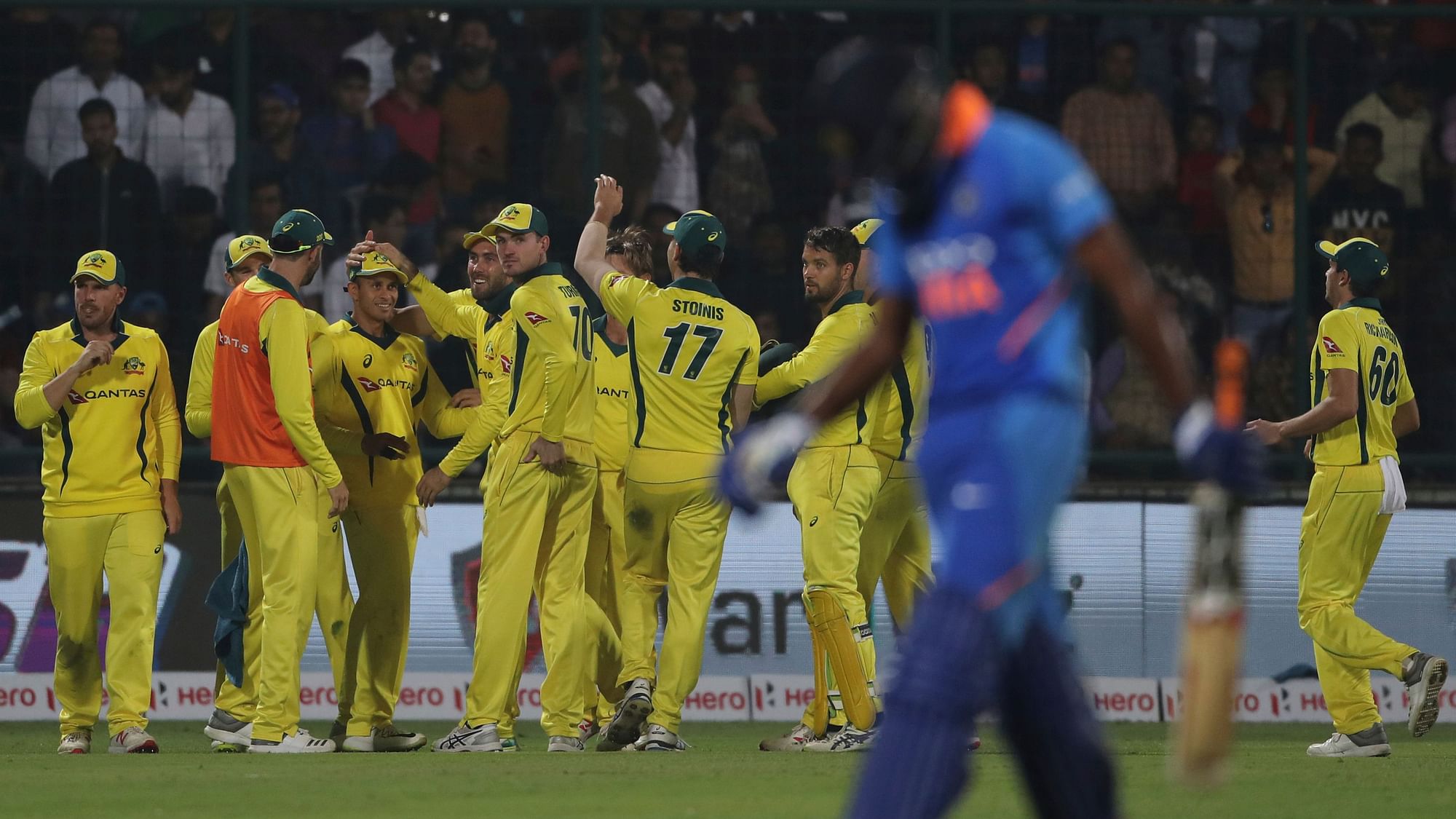 Vijay Shankar (foreground) trudges off after being dismissed during the series-deciding fifth ODI between India and Australia at New Delhi.