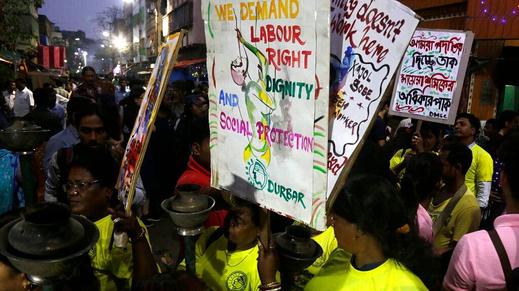 Sex workers hold a torch light rally demanding work rights ahead of International Women’s Day at Sonagachhi in Kolkata on 3 March 2019.&nbsp;