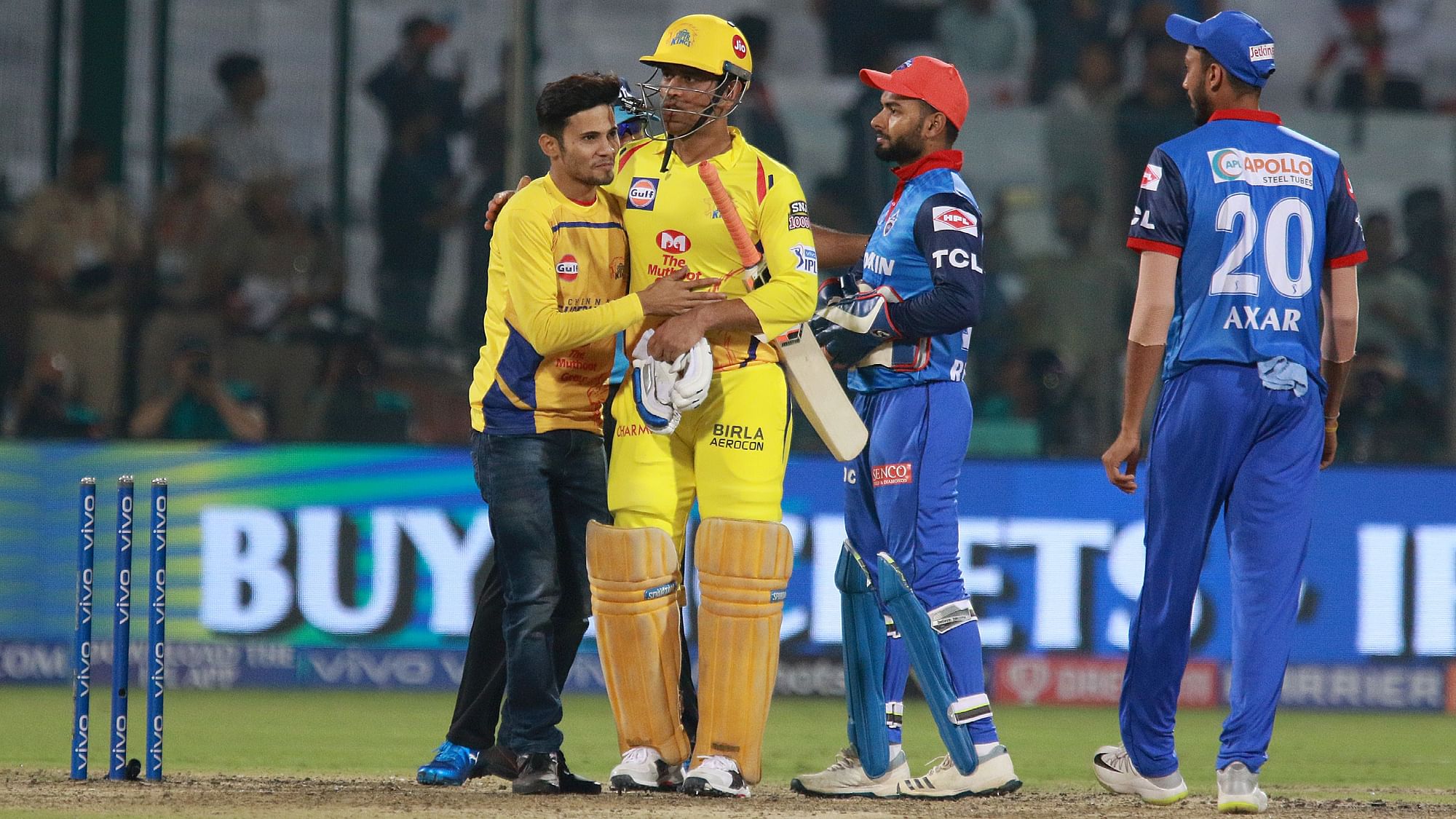 Before being escorted by the security guards, the fan managed to get a hug from Dhoni. 